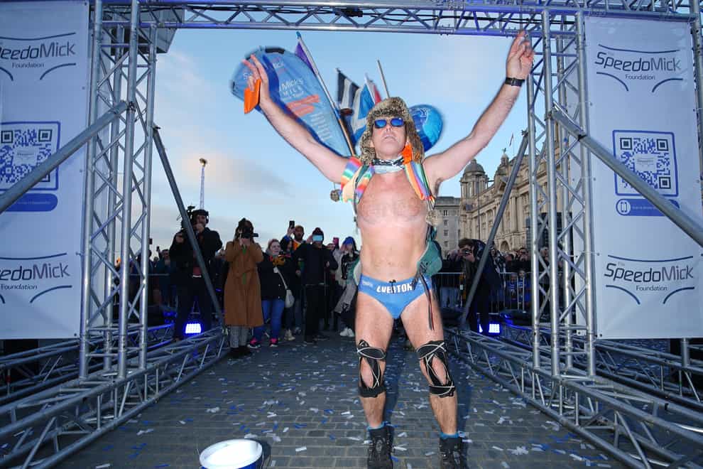 Mick Cullen, otherwise known as Speedo Mick, arrives in Liverpool, where he finished a 2,500-mile, five-month trek across the UK and Ireland (Peter Byrne/PA)