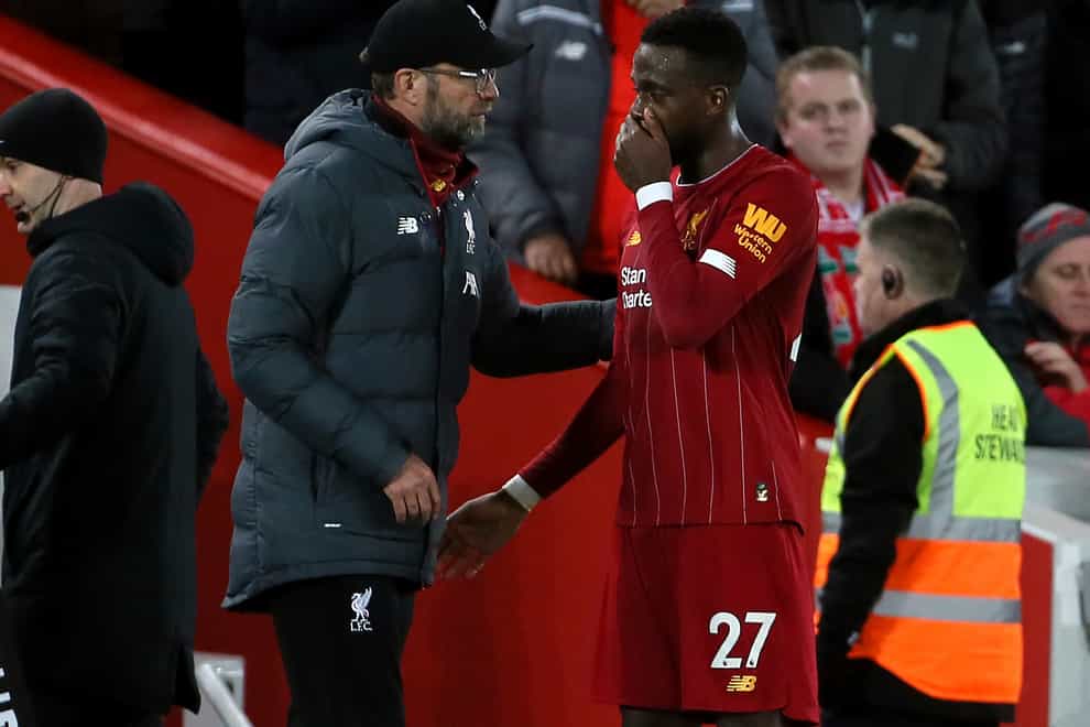 Liverpool manager Jurgen Klopp, left, will be well aware that Divock Origi will be out of contract next summer (Richard Sellers/PA)