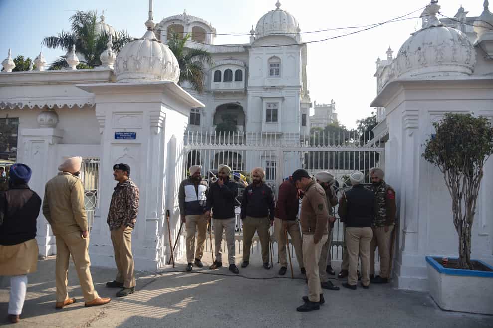 Policemen stand guard outside the office of Shiromani Gurdwara Parbandhak Committee, the organisation responsible for the management of Sikh temples (Prabhjot Gill/AP/PA)