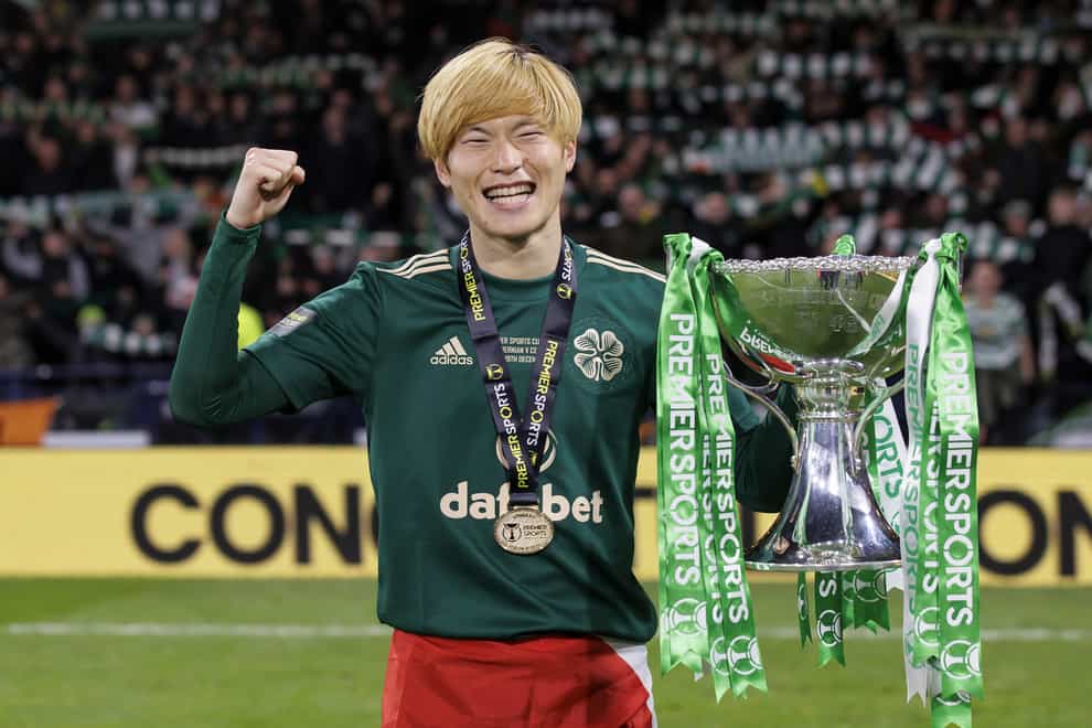 Celtic’s Kyogo Furuhashi celebrates with the Premier Sports Cup (Jane Barlow/PA)