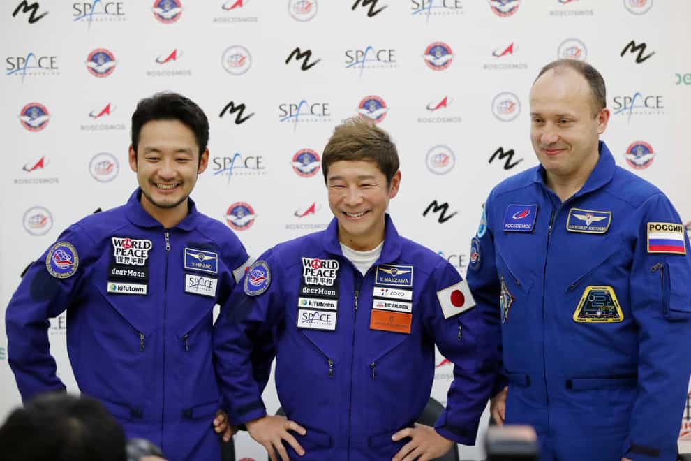 Roscosmos cosmonaut Alexander Misurkin, right, space flight participants Yusaku Maezawa, centre, and Yozo Hirano (Shamil Zhumatov/Pool Photo via AP)