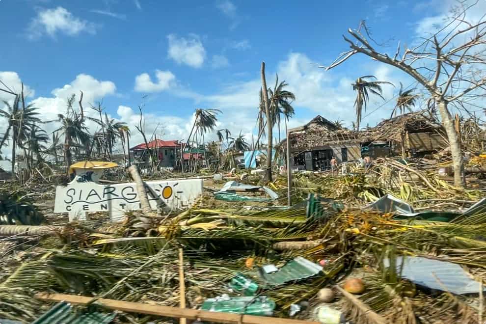 Toppled trees and structures are scattered due to Typhoon Rai in Siargao island, Surigao del Norte, southern Philippines (Office of the Vice President via AP)