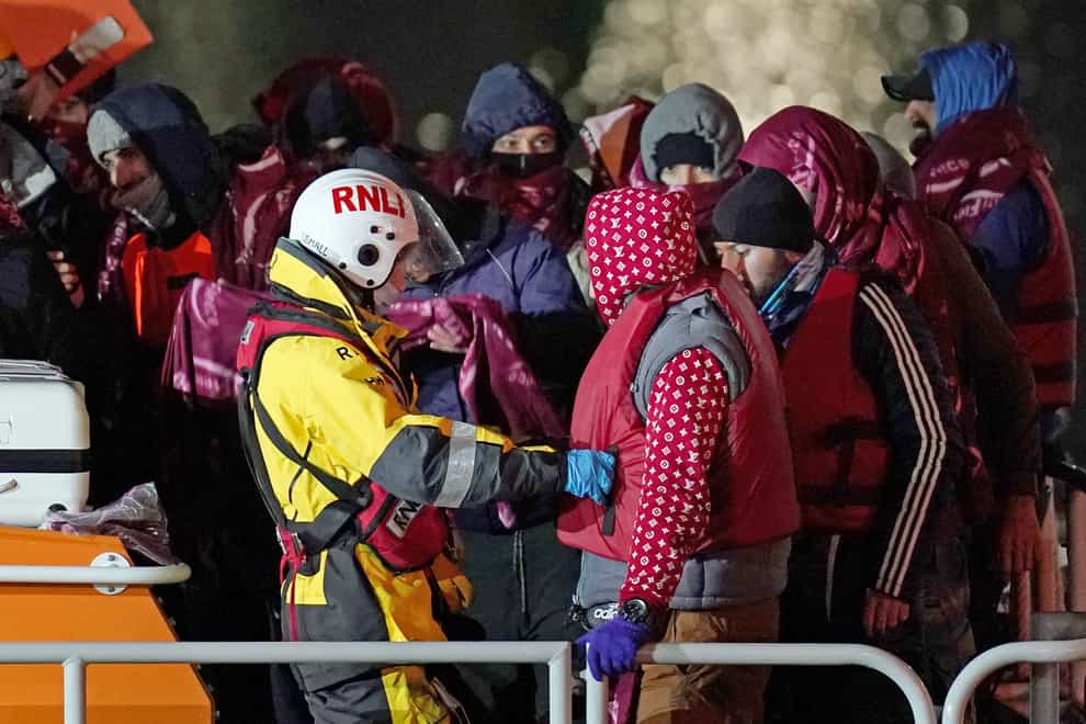 A group of people thought to be migrants are brought in to Dover, Kent, by the RNLI, in November (Gareth Fuller/PA)