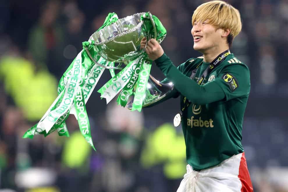 Celtic’s Kyogo Furuhashi celebrates with the trophy (Jane Barlow/PA)