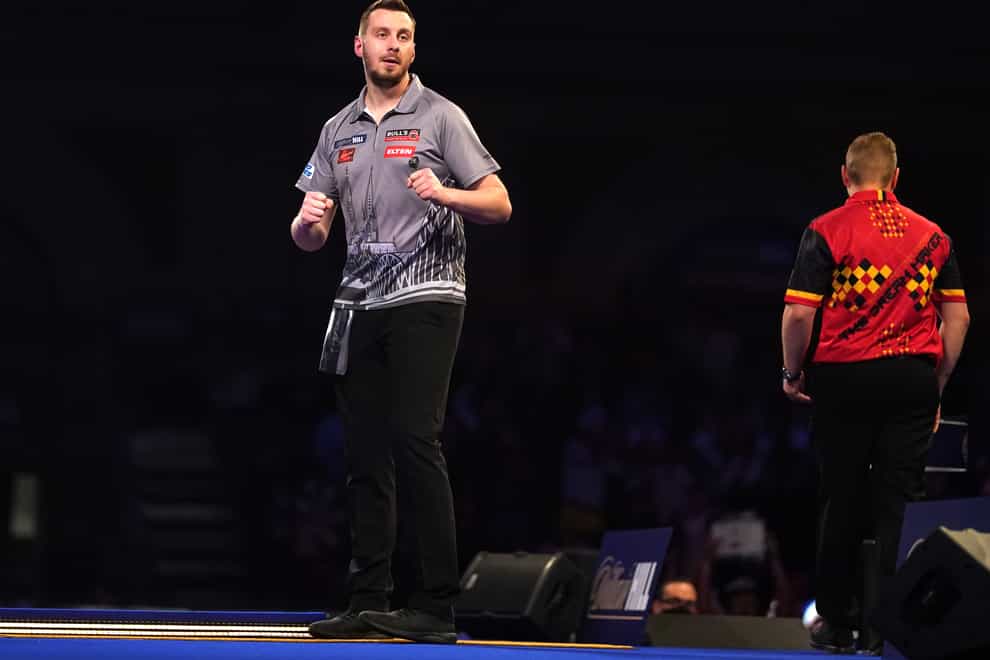 Florian Hempel (left) pulled off the shock of the tournament so far at Alexandra Palace (Adam Davy/PA)