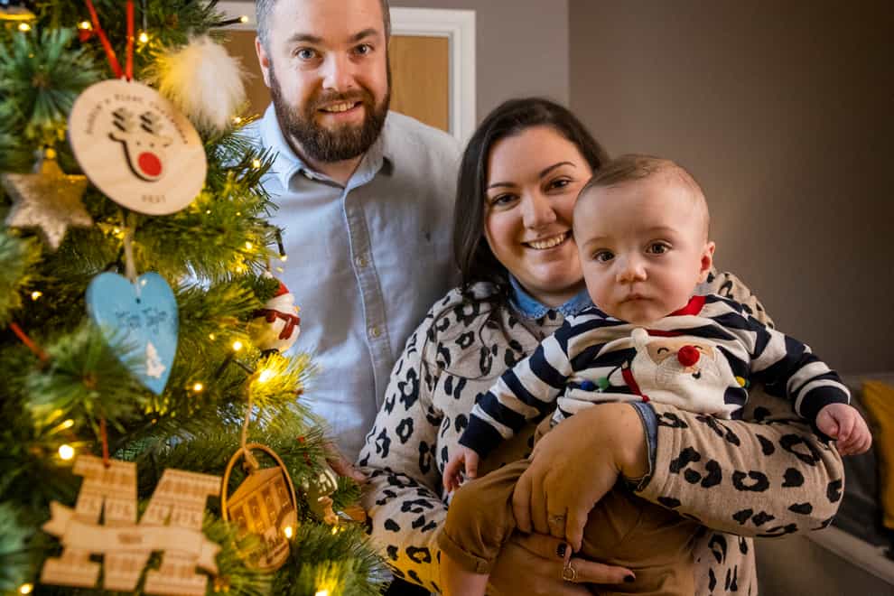 Martin and Gillian Johnston with their son Robert ‘Robbie’ Johnston at their home in Ballyclare, Northern Ireland (Liam McBurney/PA)
