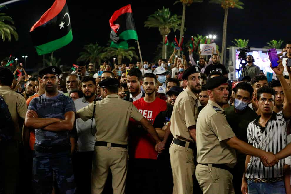 Demonstrators protest in Tripoli, Libya, in opposition to parliament passing a vote of no-confidence in the transitional government (Yousef Murad/AP)