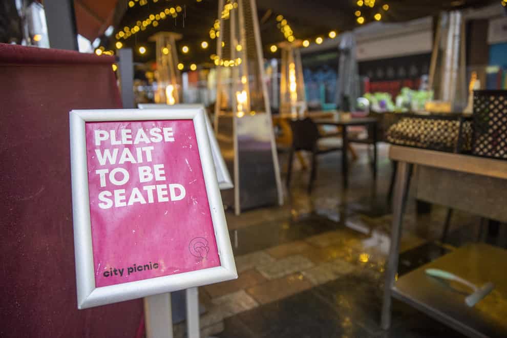 Signage at City Picnic in Belfast asking customers to wait to be seated (PA)