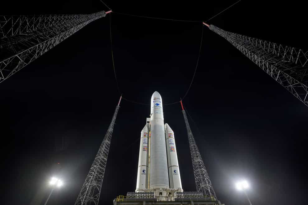 In this photo provided by NASA, Arianespace’s Ariane 5 rocket with NASA’s James Webb Space Telescope onboard, is seen at the launch pad, Thursday, Dec. 23, 2021, at Europe’s Spaceport, the Guiana Space Center in Kourou, French Guiana. The James Webb Space Telescope has infrared vision, allowing it to peer deeper into the universe, all the way to the first stars and galaxies. Liftoff is set for Saturday morning, Dec. 24, on a French rocket from South America. (Bill Ingalls/NASA via AP)