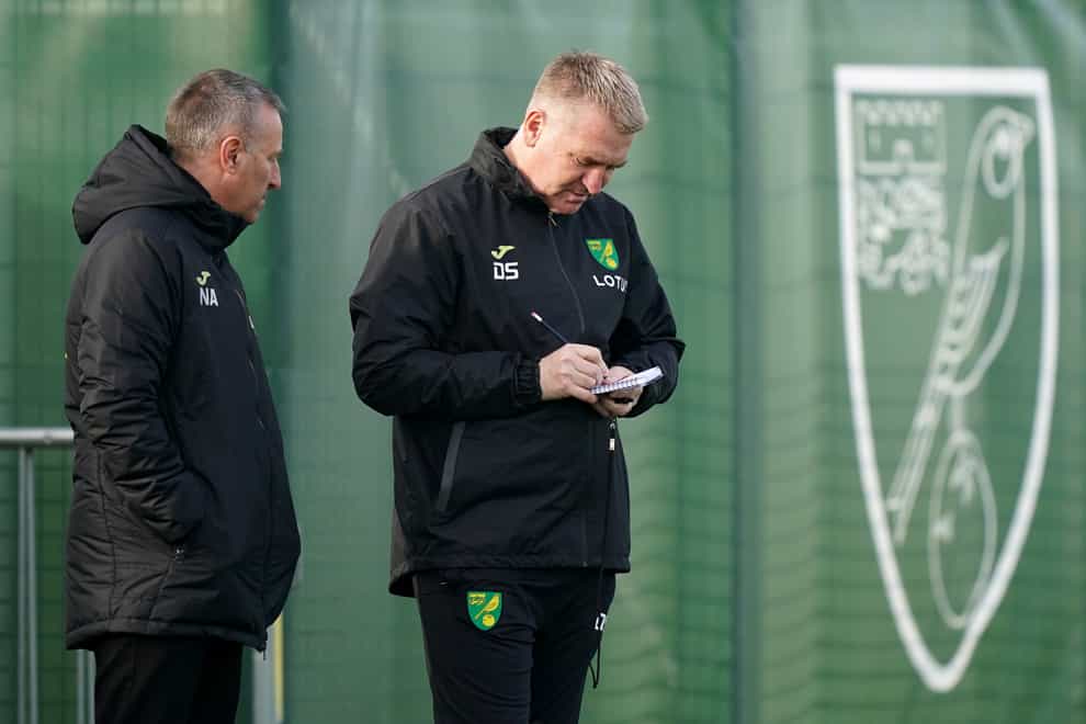 Norwich head coach Dean Smith (right) is again facing up to a depleted squad for the visit of Arsenal (Tim Goode/PA)