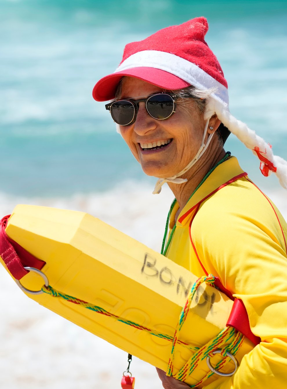 A lifesaver dons a Santa hat (Rick Rycroft/AP)