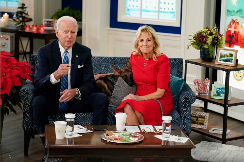 President Joe Biden and First Lady Jill Biden have thanked US troops, alongside their dog Commander (Carolyn Kaster/AP)