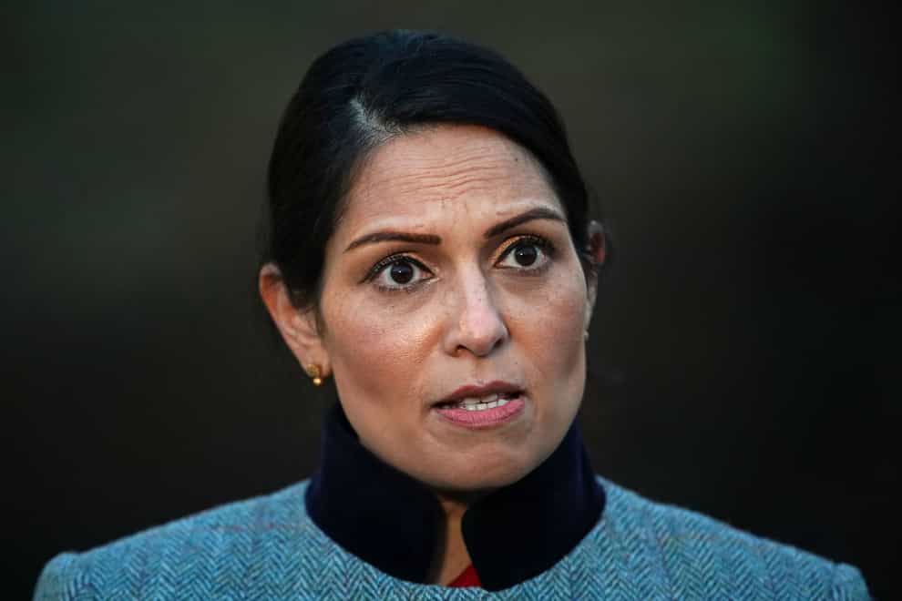 People who post racist abuse online could be banned from attending football matches in England and Wales for up to 10 years, Priti Patel has said (Aaron Chown/PA)