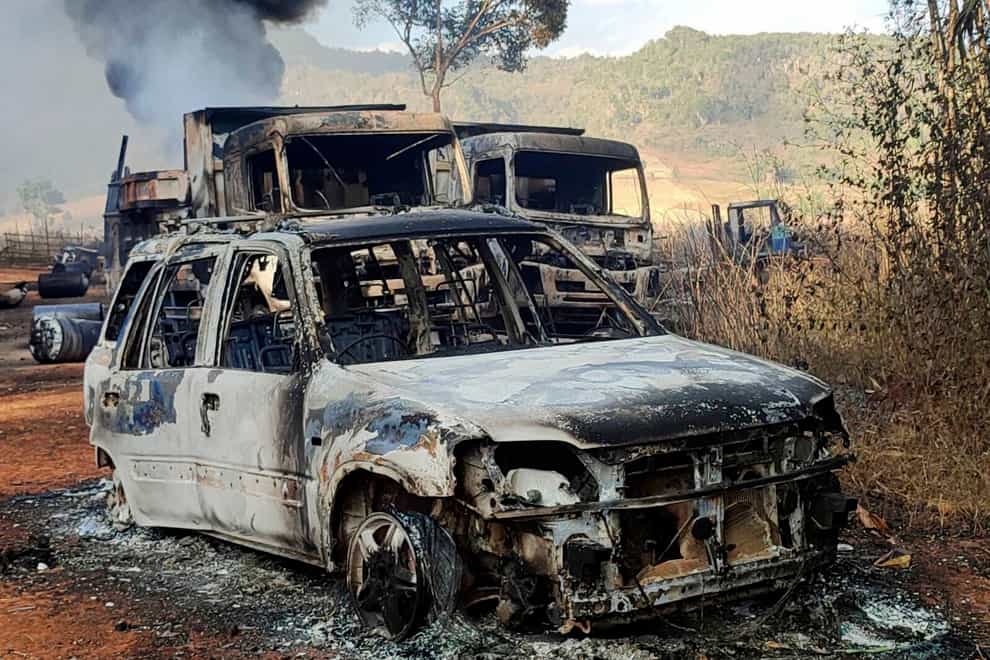 Vehicles smoulder in Hpruso township, Kayah state, Myanmar, on Friday (Karenni Nationalities Defence Force via AP)