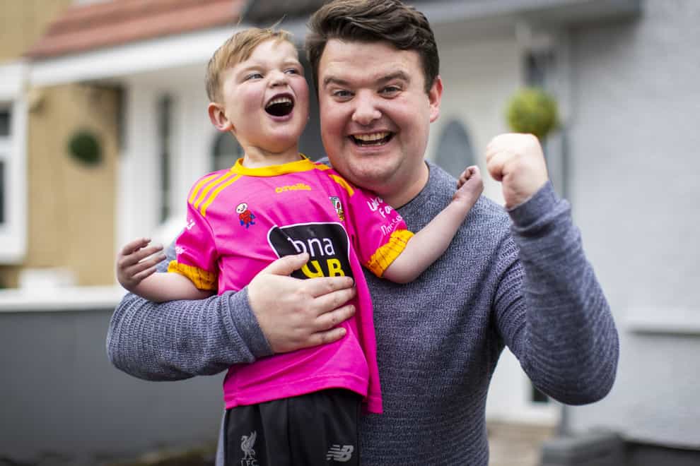 Four-year-old Daithi MacGabhann with his dad Mairtin MacGabhann at their home in Belfast (Liam McBurney/PA)
