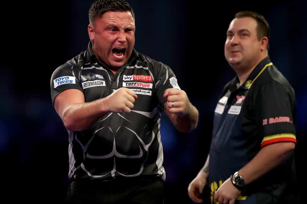 Gerwyn Price edged out Kim Huybrechts in a tense contest on Monday night (Bradley Collyer/PA)