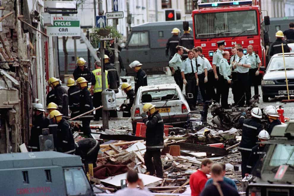 Police officers and firefighters inspecting the damage caused by a bomb explosion in Market Street, Omagh, Co Tyrone. Newly released documents from the National Archives reveal how hospitals coped with casualties coming “thick and fast” in the immediate aftermath of the Omagh bombing (Paul McErlane/PA)