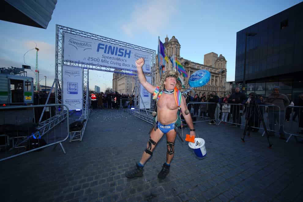 Mick Cullen, otherwise known as Speedo Mick, arrives in Liverpool, where he finished a 2,500-mile, five-month trek across the UK and Ireland (PA)