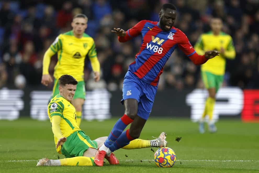 Norwich’s Sam Byram slides in against Crystal Palace midfielder Cheikhou Kouyate (Steven Paston/PA)
