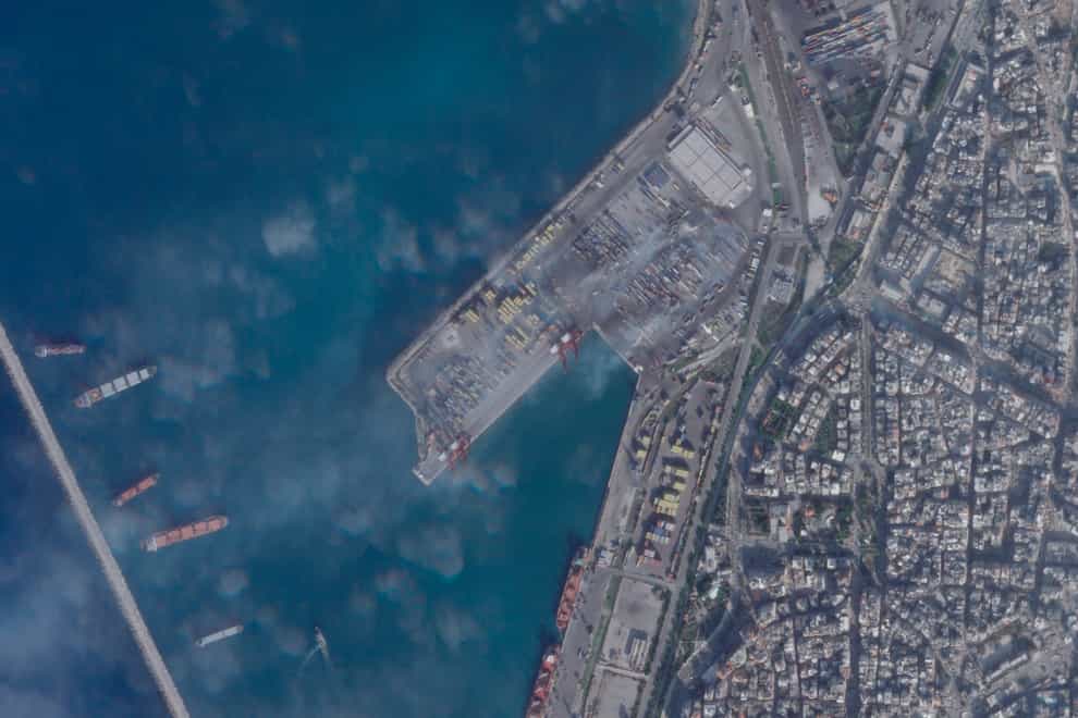 A satellite photograph shows the smouldering wreckage after an Israeli strike on the port at Latakia (Planet Labs PBC via AP)