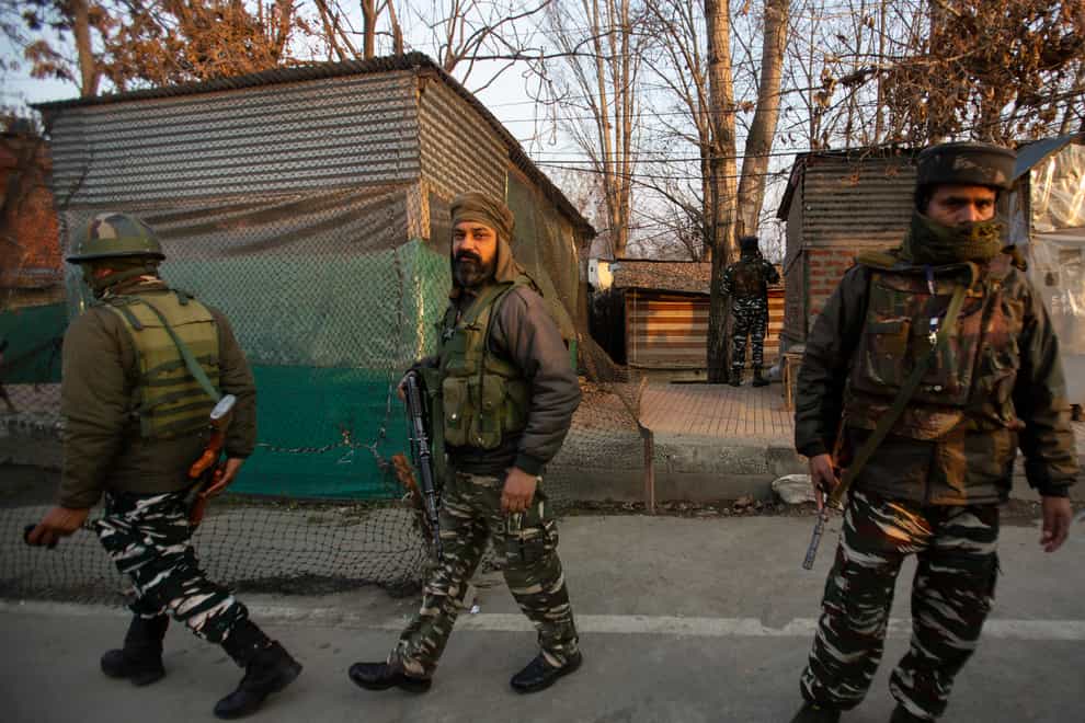 Indian paramilitary soldiers guard a check point in Srinagar  (AP Photo/Mukhtar Khan)