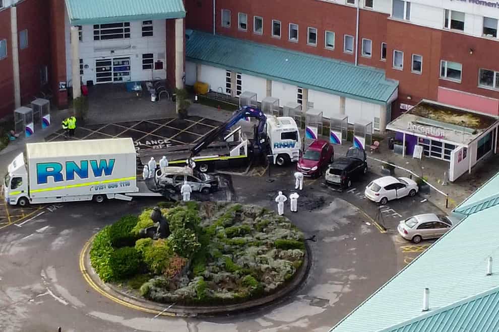 Aerial view of a damaged car being removed by forensic officers after the explosion at the Liverpool Women’s Hospital (Peter Byrne/PA)