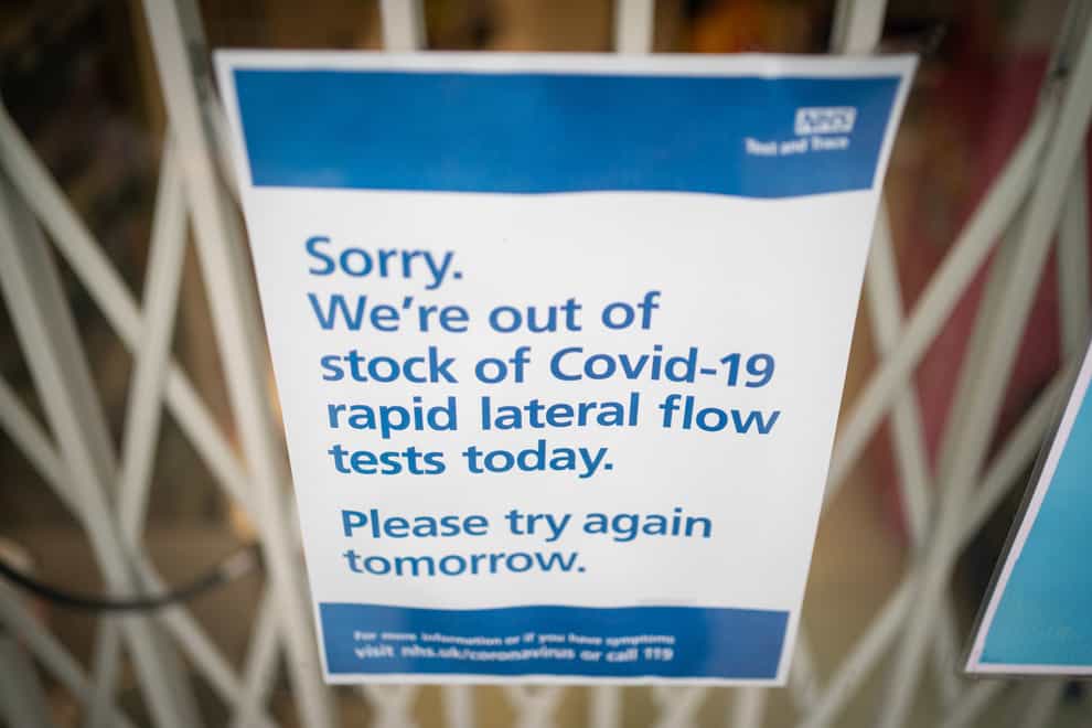 A sign saying lateral flow coronavirus tests are out of stock is seen at a pharmacists in London (Dominic Lipinski/PA)