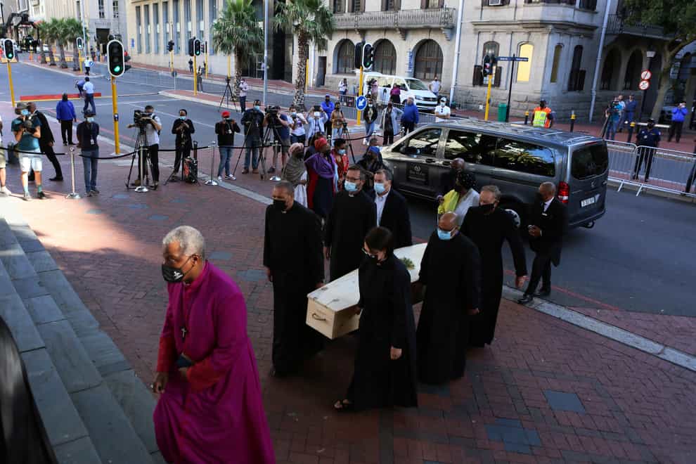 The coffin carrying the body of Anglican Archbishop Emeritus Desmond Tutu arrives at St George’s Cathedral (AP)