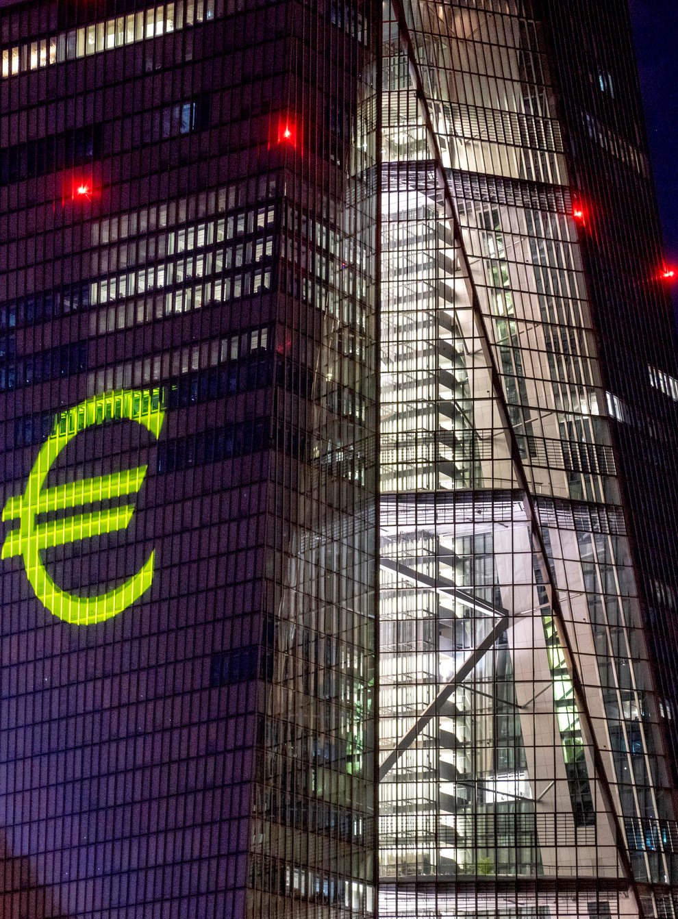 A light installation is projected on to the European Central Bank building in Frankfurt, Germany (Michael Probst/AP)