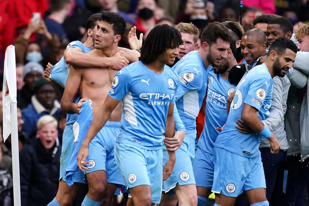 Manchester City’s Rodri (left) celebrates with team-mates after his injury-time winner against Arsenal (John Walton/PA Images).