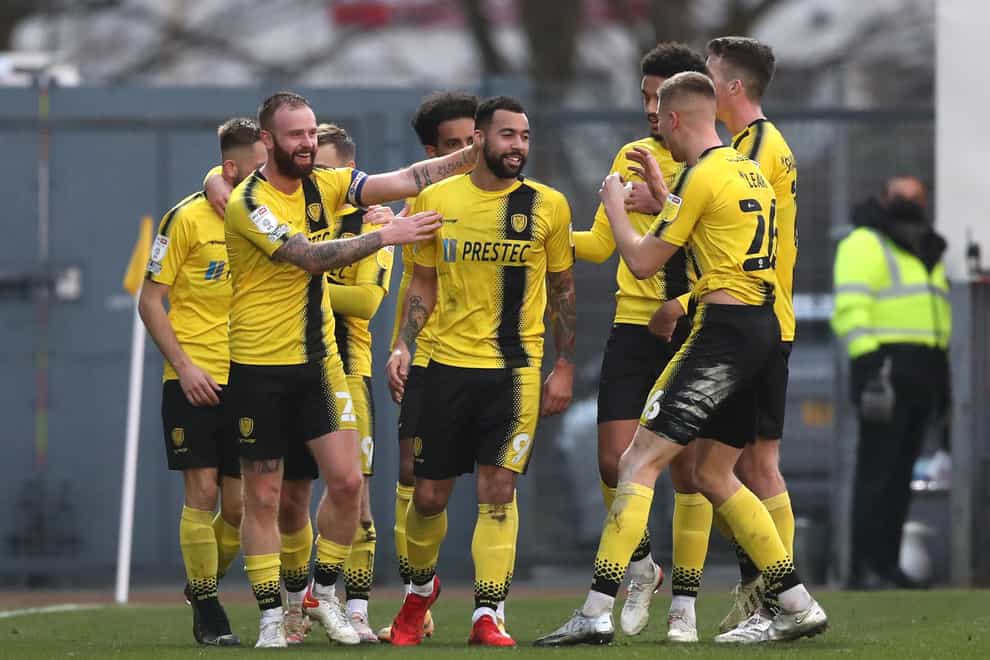 Burton’s Kane Hemmings (centre) is congratulated by team-mates after a stunning volleyed goal in a 4-1 win over Crewe (Barrington Coombs/PA Images).