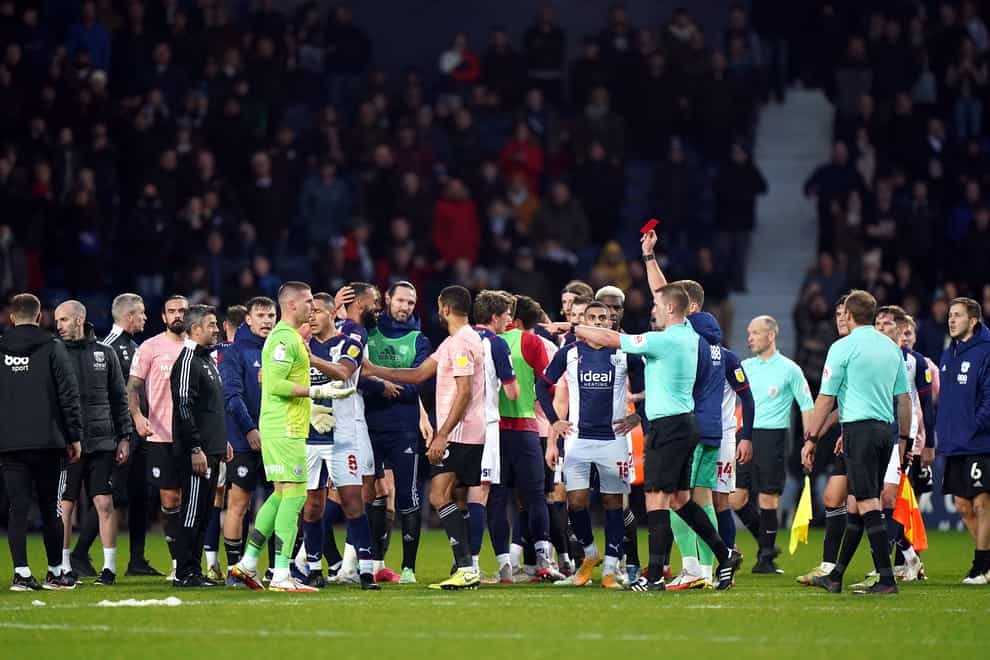 West Brom goalkeeper Sam Johnstone, in green, is shown a red card at full-time (Tim Goode/PA)