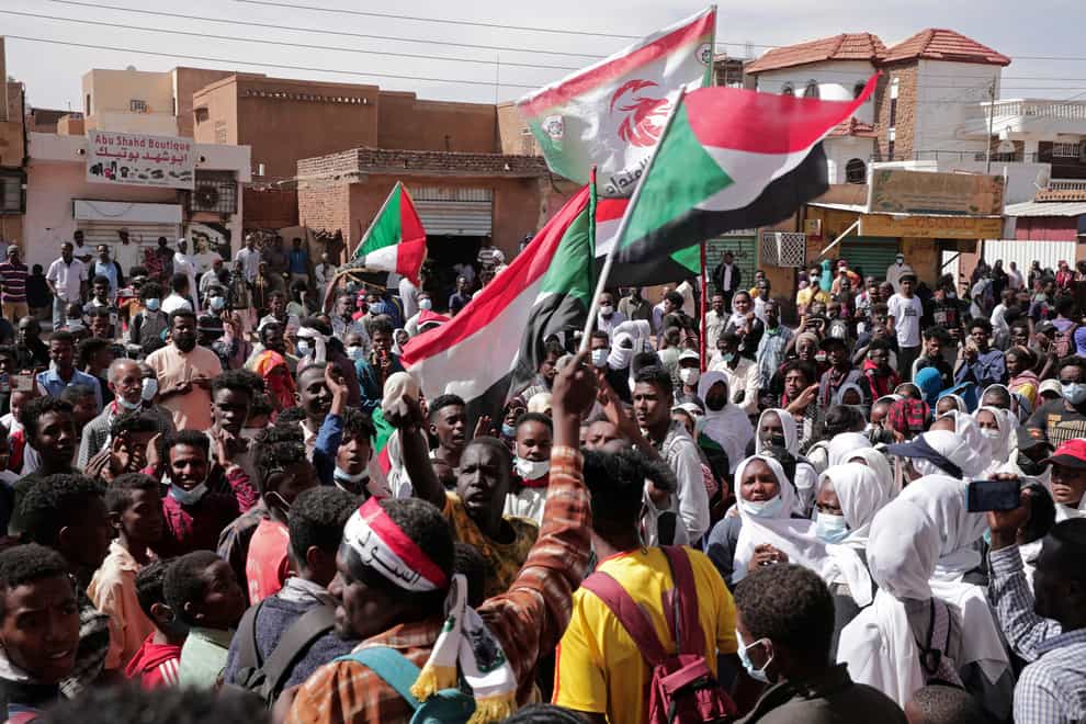 Sudanese security forces fired tear gas on Sunday to disperse protesters as thousands rallied against military rule (Marwan Ali/AP)