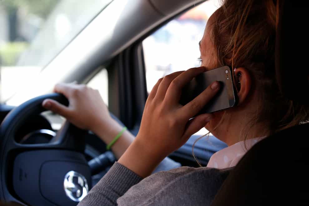 A motorist was caught driving while distracted nine times in the past four years, an investigation has found (Jonathan Brady/PA)