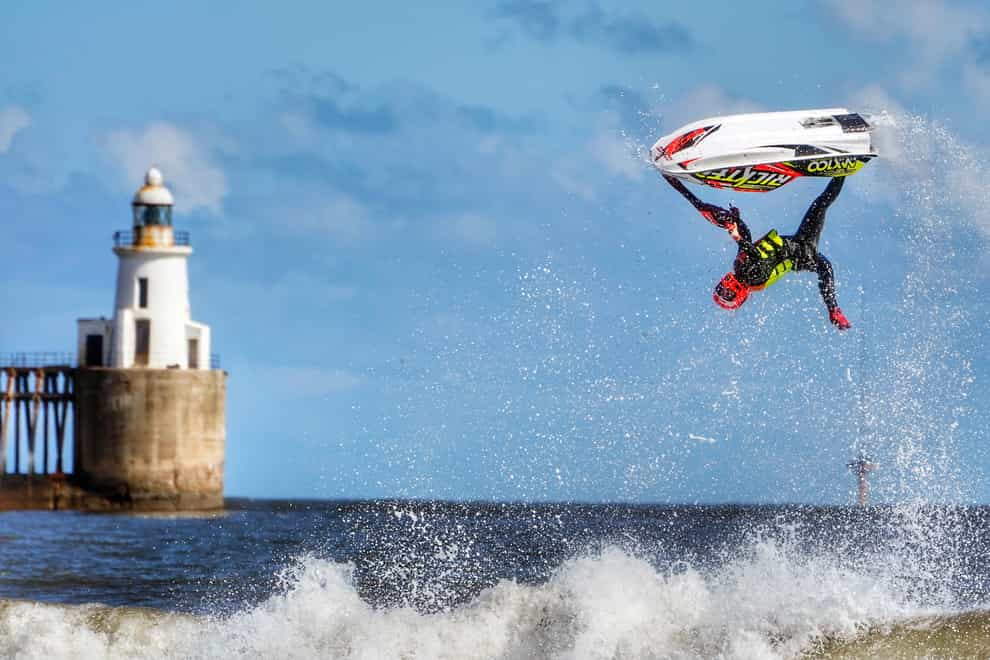 Ant Burgess practices his freestyle on a jet ski at Blyth beach in Northumberland (Owen Humphreys/PA)