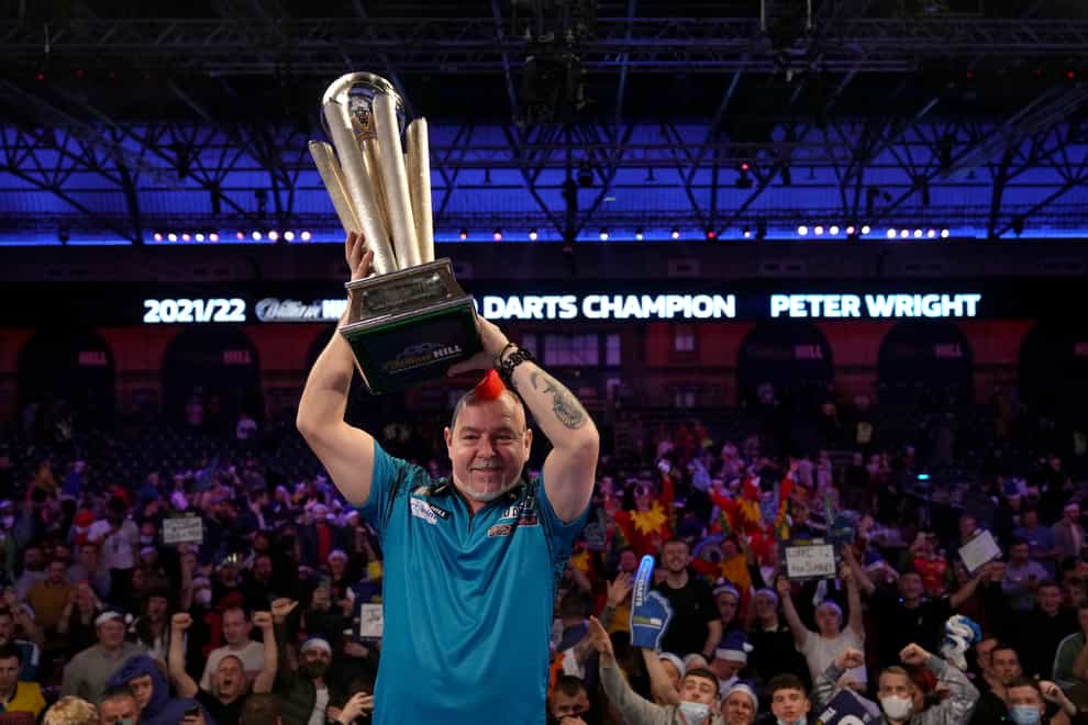 Peter Wright celebrates winning his second world title (John Walton/PA).