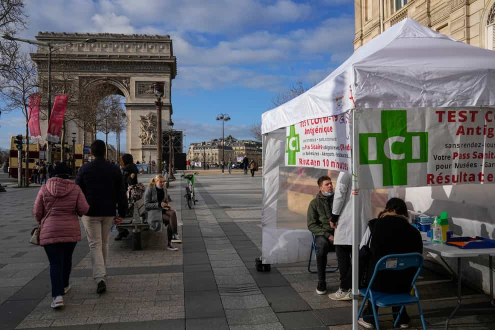 A man gets a nasal swap at a mobile Covid-19 testing site at the Champs Elysees in Paris (Michel Euler/AP)