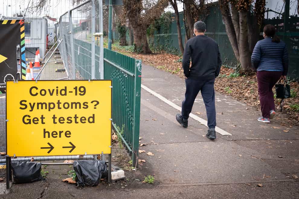 People arrive at a Covid-19 testing centre in Leytonstone, east London (Stefan Rousseau/PA)