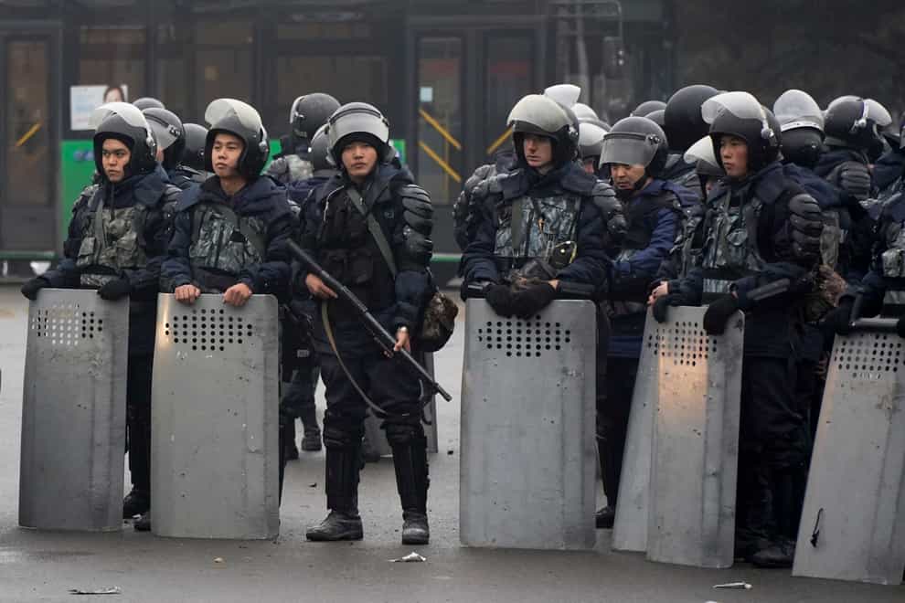 Riot police officers in Almaty, Kazakhstan (Vladimir Tretyakov/AP)