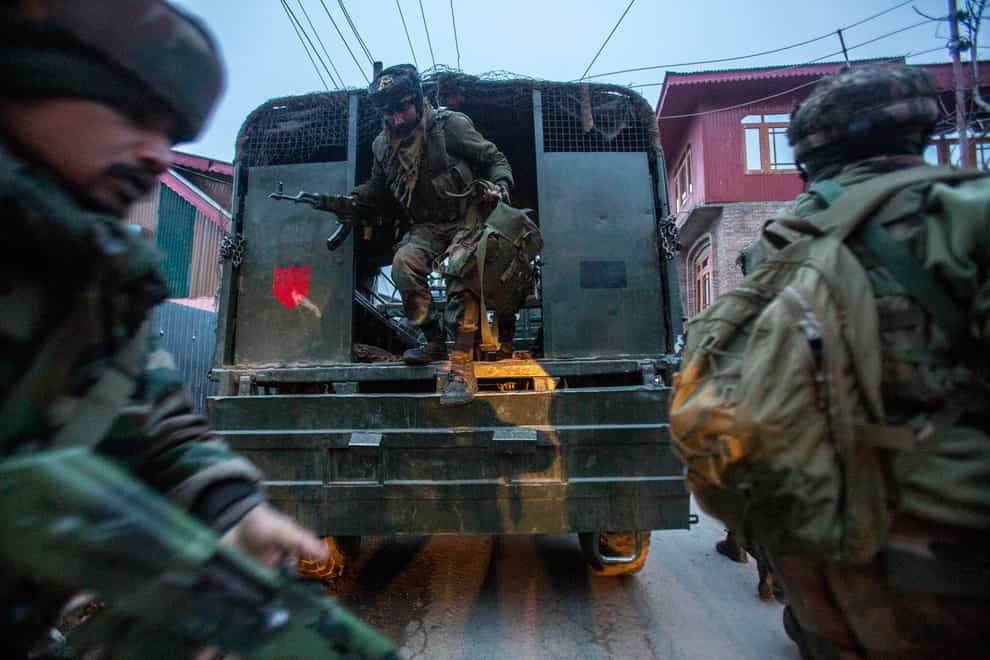 Indian army soldiers in Kashmir (Mukhtar Khan/AP)