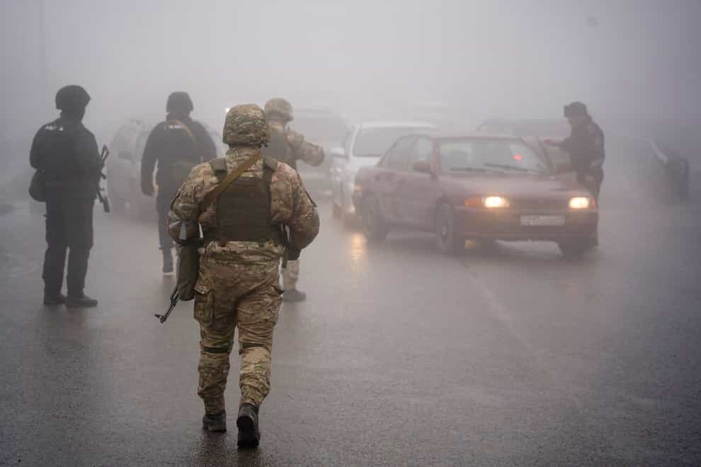 Kazakhstan’s soldiers patrol on a road in Almaty (Vladimir Tretyakov/NUR.KZ via AP)