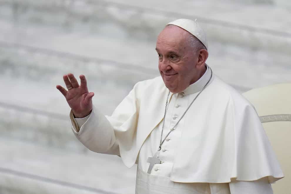Pope Francis waves to onlookers (Alessandra Tarantino/AP)
