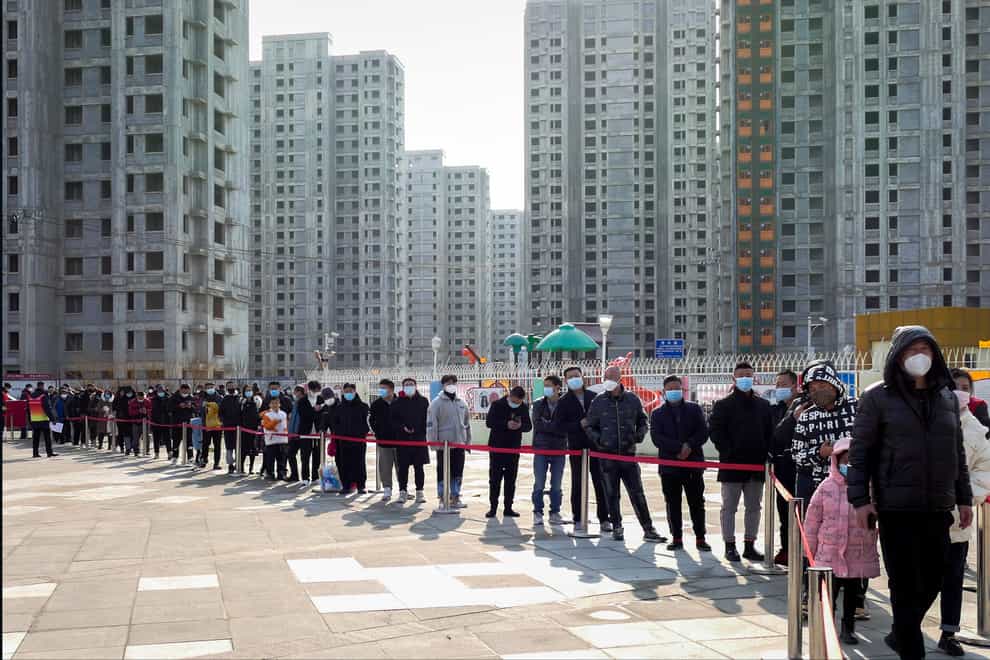 Residents line up for coronavirus testing in Tianjin (Chinatopix/AP)