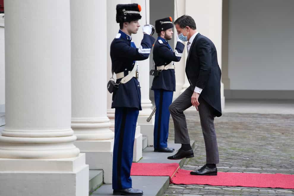 Dutch prime minister Mark Rutte arrives at Royal Palace Noordeinde in The Hague, Netherlands (Peter Dejong/AP)
