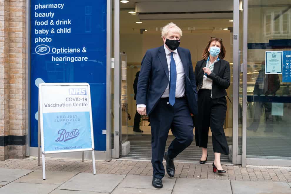Prime Minister Boris Johnson leaves the Boots Pharmacy in Uxbridge, west London, after a visit to the coronavirus vaccination clinic (Dominic Lipinski/PA)