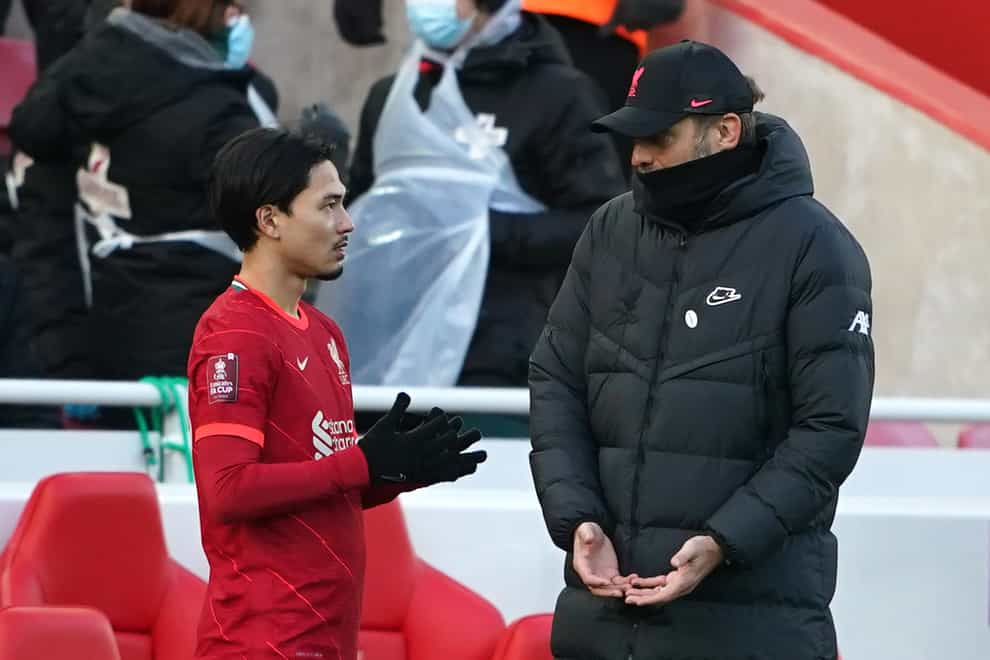 Liverpool manager Jurgen Klopp said they desperately need Takumi Minamino while they are without Mohamed Salah and Sadio Mane (Peter Byrne/PA)
