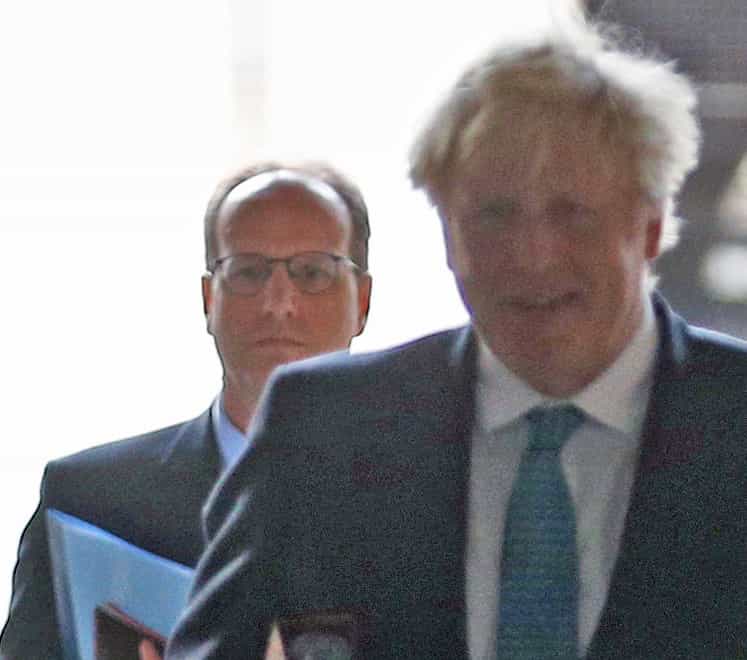 Martin Reynolds (left) and Boris Johnson walking back to Downing Street after a cabinet meeting