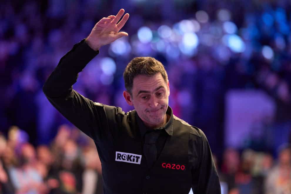 Ronnie O’Sullivan waves to the crowd as he celebrates defeating Jack Lisowski during day three of the 2022 Cazoo Masters (John Walton/PA)