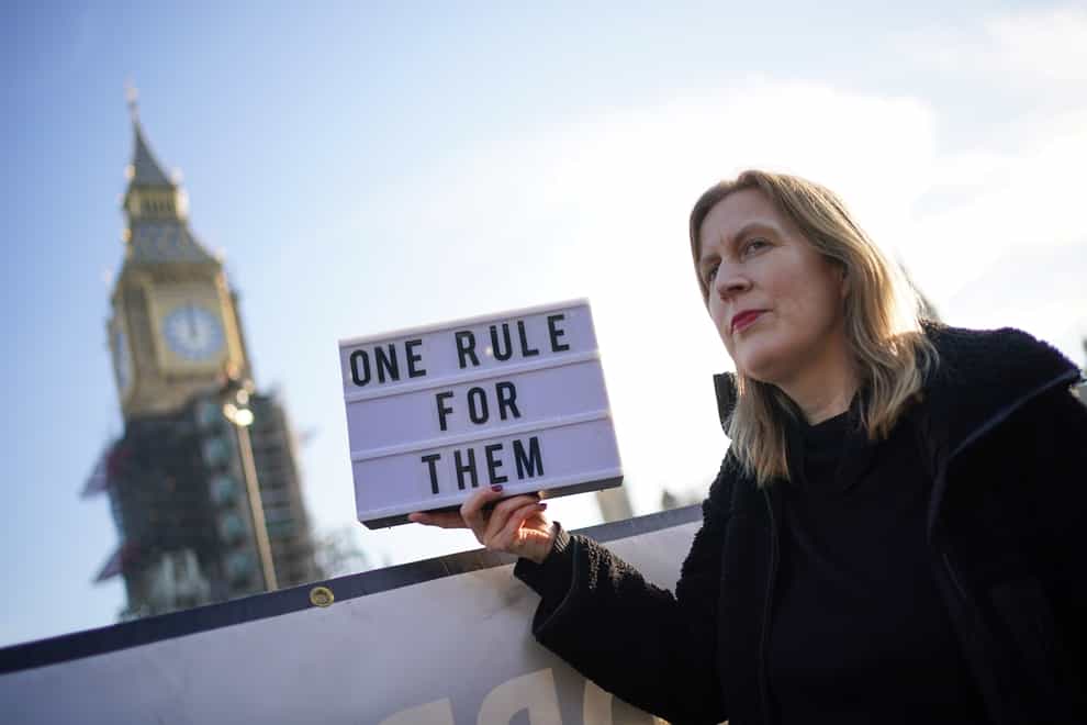 A protester in Parliament Square in Westminster, London (PA)
