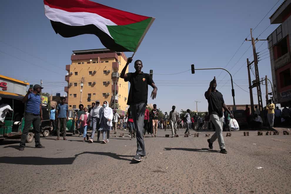People march during a protest to denounce the October 2021 military coup, in Khartoum, Sudan (AP Photo/Marwan Ali)